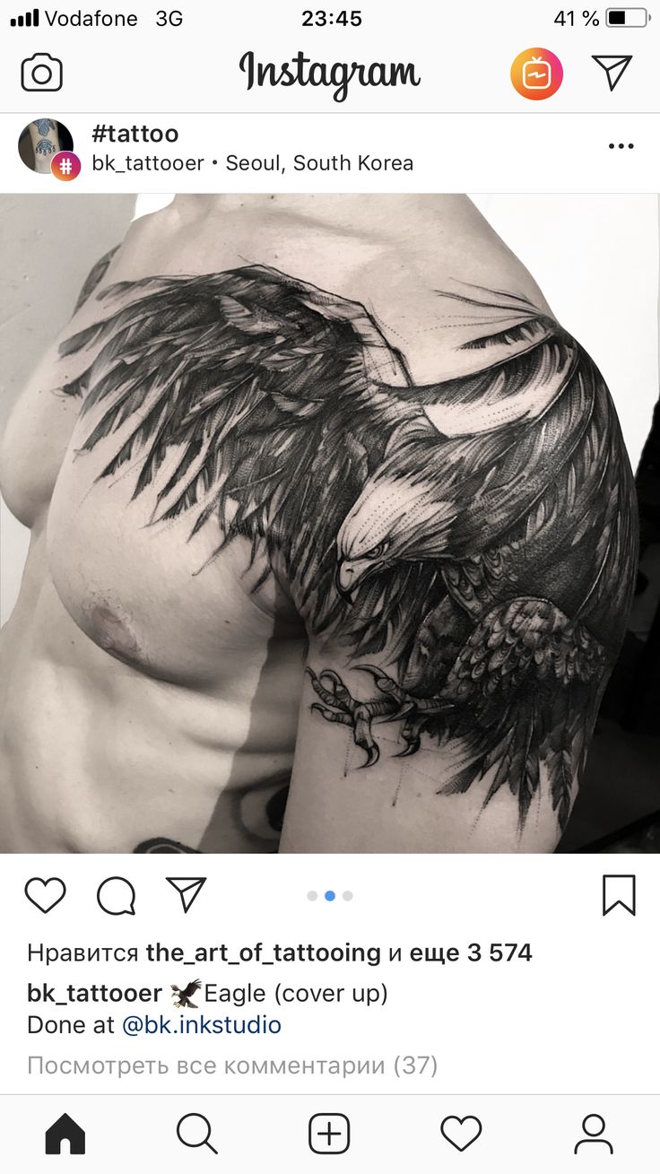 an image of a man's arm with black wings on his chest and the words ins