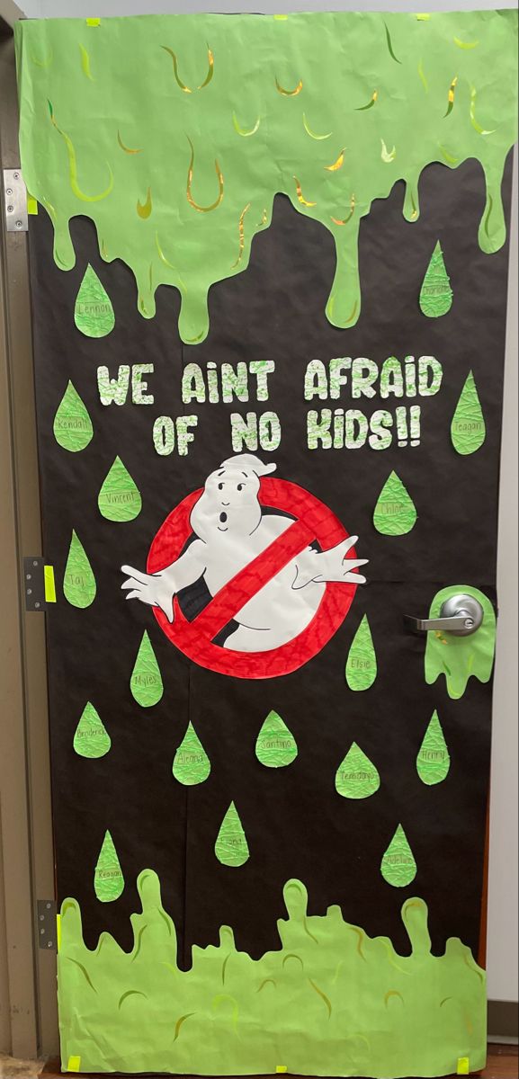 a door decorated to look like ghost with green trees and raindrops on it