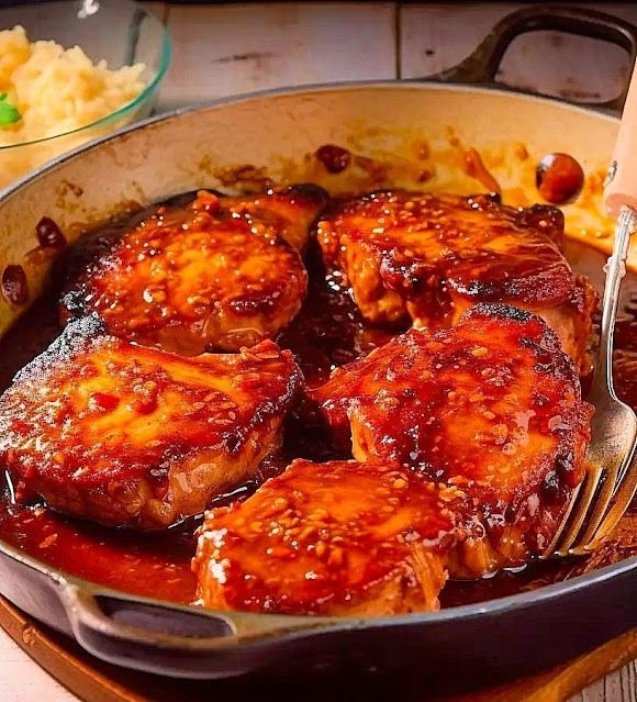 a pan filled with meat covered in sauce