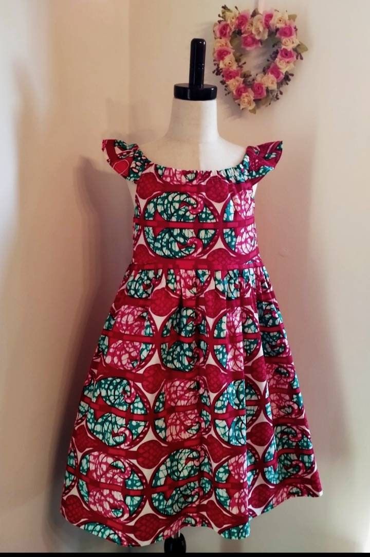 Beautiful hand made African style dress made from 100%cotton Ankara this dress is age 7-8 years but I can make different sizes on request x Cotton Dress-up Dresses, Fitted Cotton Sundress For Dress-up, Fitted Cotton Sundress For Dress-up Occasions, Handmade Pink Cotton Dress, Handmade Multicolor Cotton Dresses, Handmade Cotton Summer Dresses, Red Cotton Sundress With Ruffles, Handmade Red Summer Dresses, Cotton Frocks For Kids