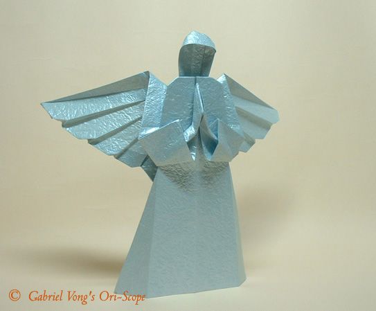 an origami angel is shown in light blue