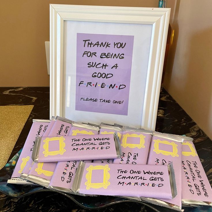 there are some candy bars in front of a framed sign that says thank you for being such a good friend