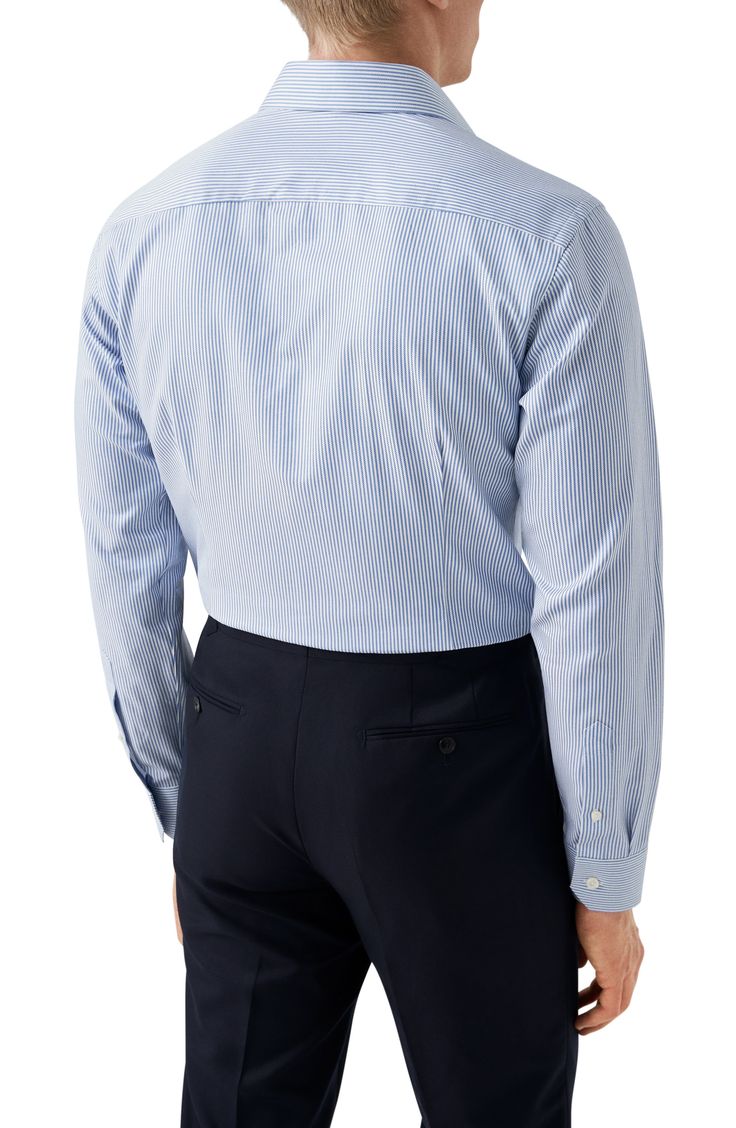 Cut in a slim fit, this sharp dress shirt is constructed from a high-performance, crease-resistant blend of cotton and organic cotton and fitted with a classic spread collar. French placket Spread collar with collar stays Convertible French cuffs 50% organic cotton, 50% cotton Machine wash, line dry Imported Timeless Fitted Top For Business Casual, Timeless Fitted Top For Office Wear, Timeless Fitted Business Tops, Tailored Business Tops With Concealed Placket, Fitted Business Tops With Spread Collar, Fitted Blue Dress Shirt For Office, Fitted Spread Collar Top For Business, Fitted Top With Spread Collar For Business, Blue Fitted Dress Shirt With Fold Down Collar