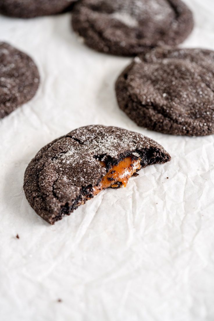 chocolate cookies with an orange peel in the middle