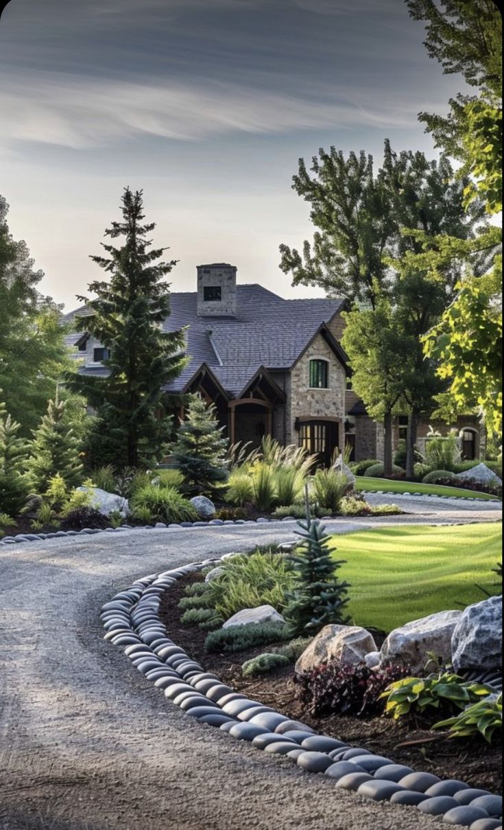 a large house surrounded by trees and rocks