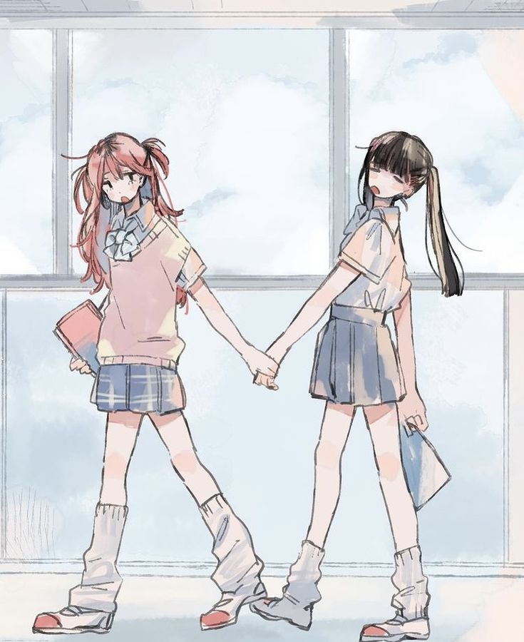 two girls holding hands in front of a window