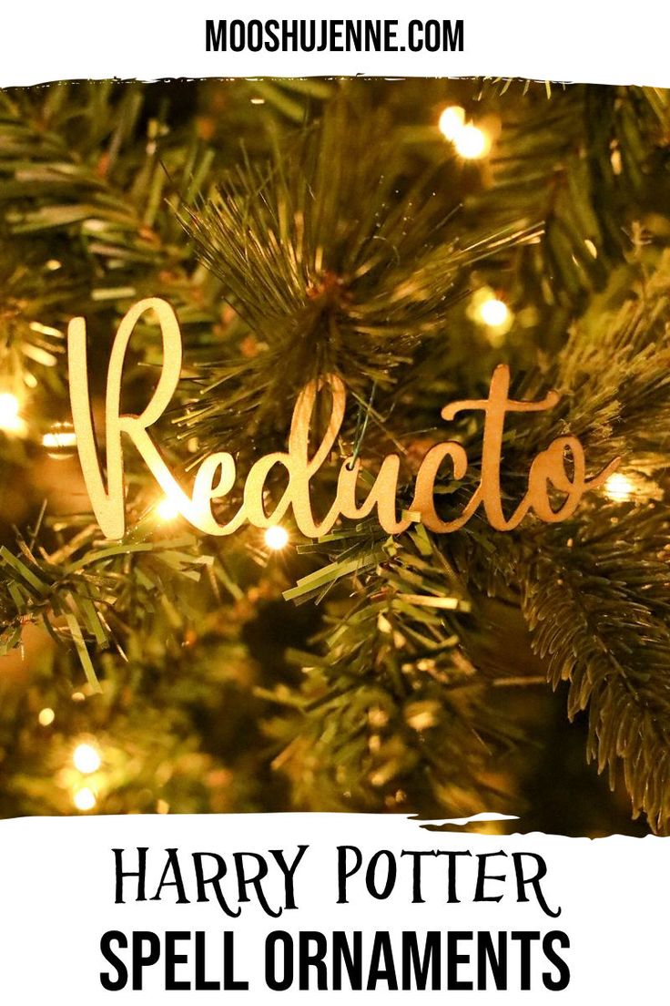 harry potter spell ornaments on a christmas tree with the words redacto in gold