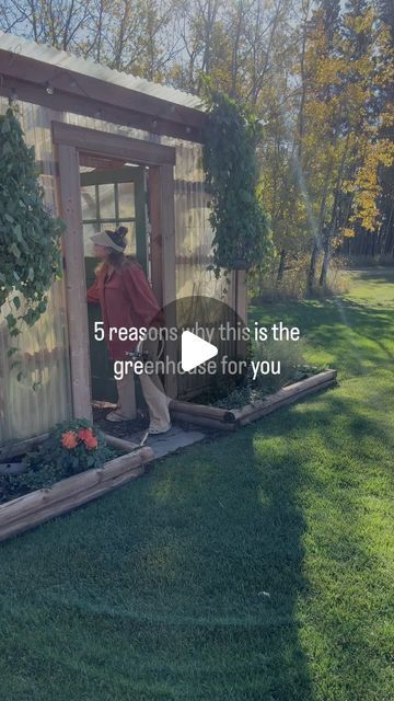 a man standing in the doorway of a small shed with plants growing out of it