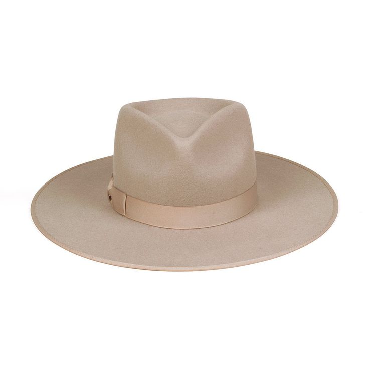 Lack of Color Zulu Rancher. Inspired by vintage men’s styles, this hat is designed to make a statement. A stiffened wool fedora with rigid crown design. Trimmed on hat and rim with tonal grosgrain ribbon. Sand Rancher fedora hat.Trimmed with tonal sand grosgrain edged hat rim and bow ribbon detail. 100% soft Australian woolSpot / specialist cleanBrim measures 10 cm / 3.95”Classic crown heightRigid crown designUnisex styleThis hat is accredited with a UPF Rating 50+ (Australian Tested) Size + Fit: Rancher sizing runs slightly wide/large due to crown design Sizing runs approx. 0.5-1cm larger than tagged size E.g. - a 55cm tagged Rancher's true measurement is 55.5 - 56cm Please size down or add a hat filler if you are in-between sizes. Bohemian Mama, Rancher Hat, Women Hats Fashion, Green Cap, Lack Of Color, Fashion Cap, Wool Fedora, Bow Ribbon, Crown Design