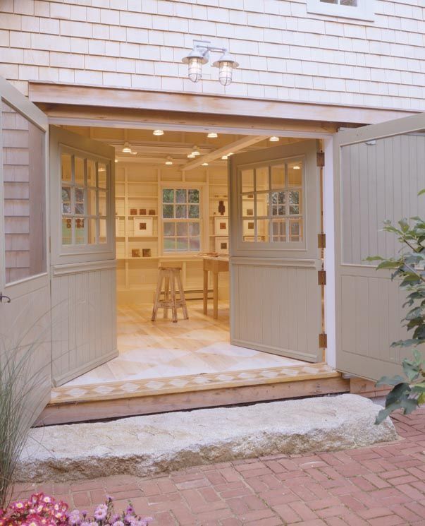 an open garage door showing the dining area