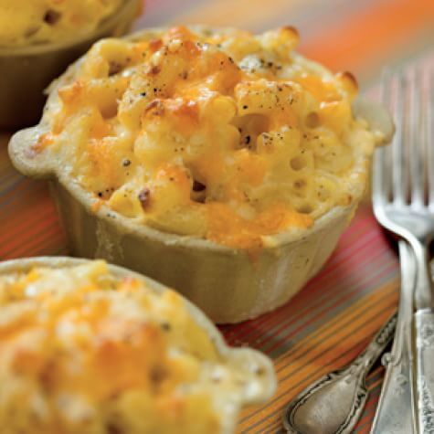 three small cups filled with macaroni and cheese