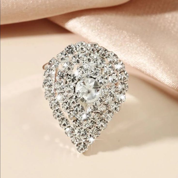 This Beauty Is Sure To Make A Statement With Its Sparkling Rhinestone And Center Large Rhinestone And It’s Adjustable. Elegant Bling Crystal Ring For Party, Elegant Party Crystal Ring With Bling, Elegant Crystal Ring With Bling For Party, White Sparkling Crystal Ring For Party, Elegant Rhinestone Crystal Ring, Diamond White Wedding Rings With Rhinestones, Elegant Formal Crystal Ring With Rhinestones, Wedding Rings In Diamond White With Rhinestones, Elegant Bling Crystal Ring