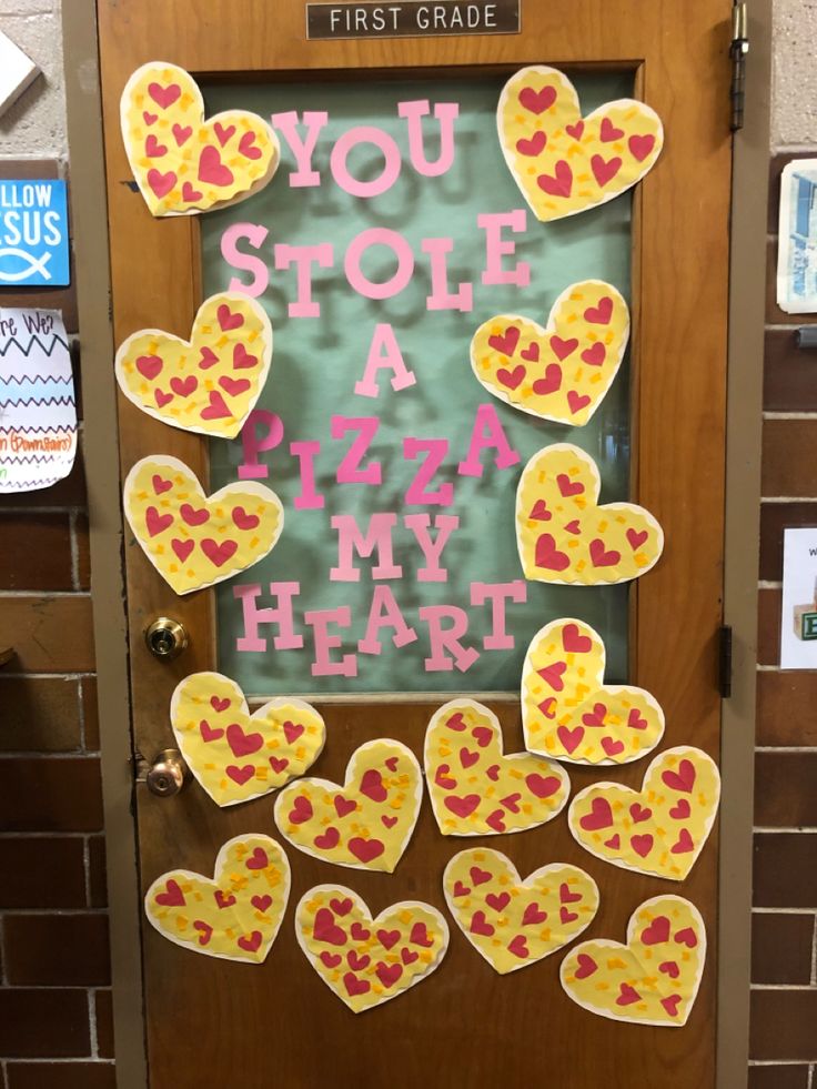 a door decorated with lots of hearts and the words you stole a pizza my heart