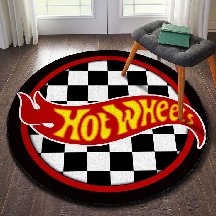 a black and white checkered rug with the word hot wheels on it