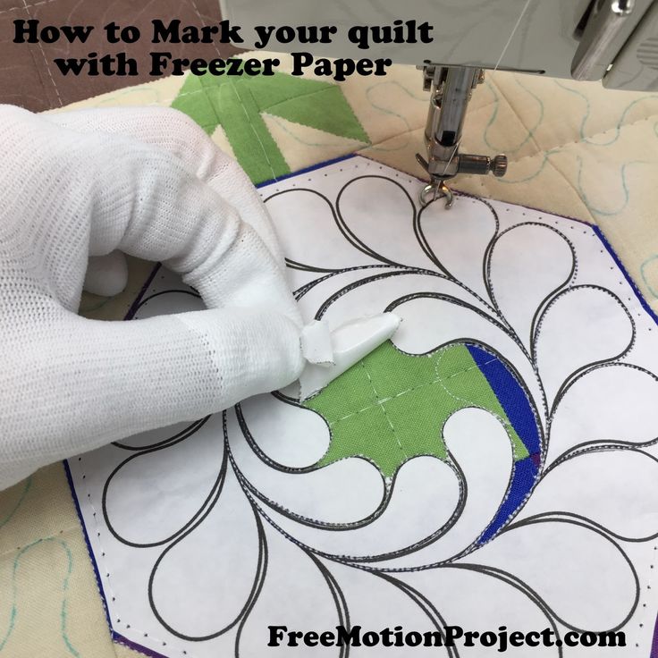 someone using a machine to make a quilt with the text how to mark your quilt with freezer paper