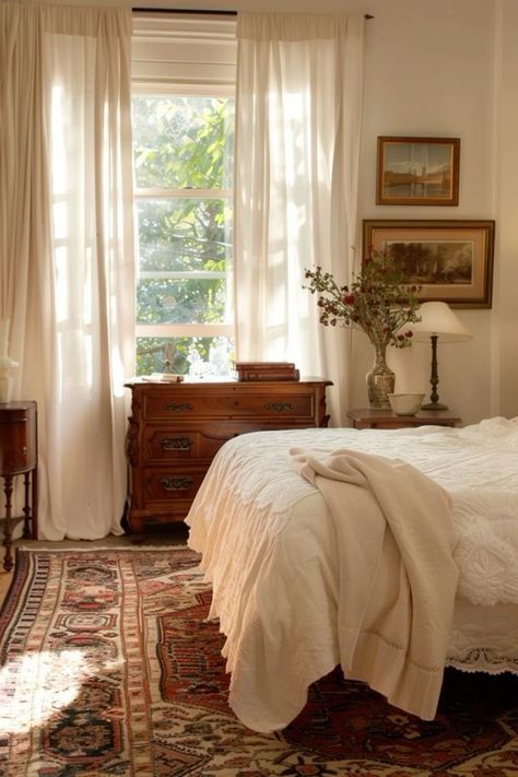 a bedroom with a bed, dresser and window in it's centerpieces