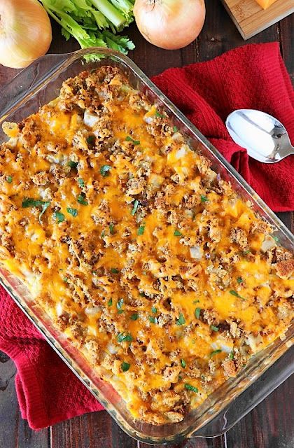 a casserole dish with cheese and onions on the side