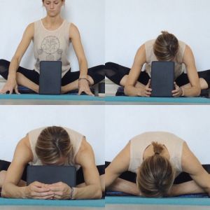 a woman is sitting on the floor with her laptop