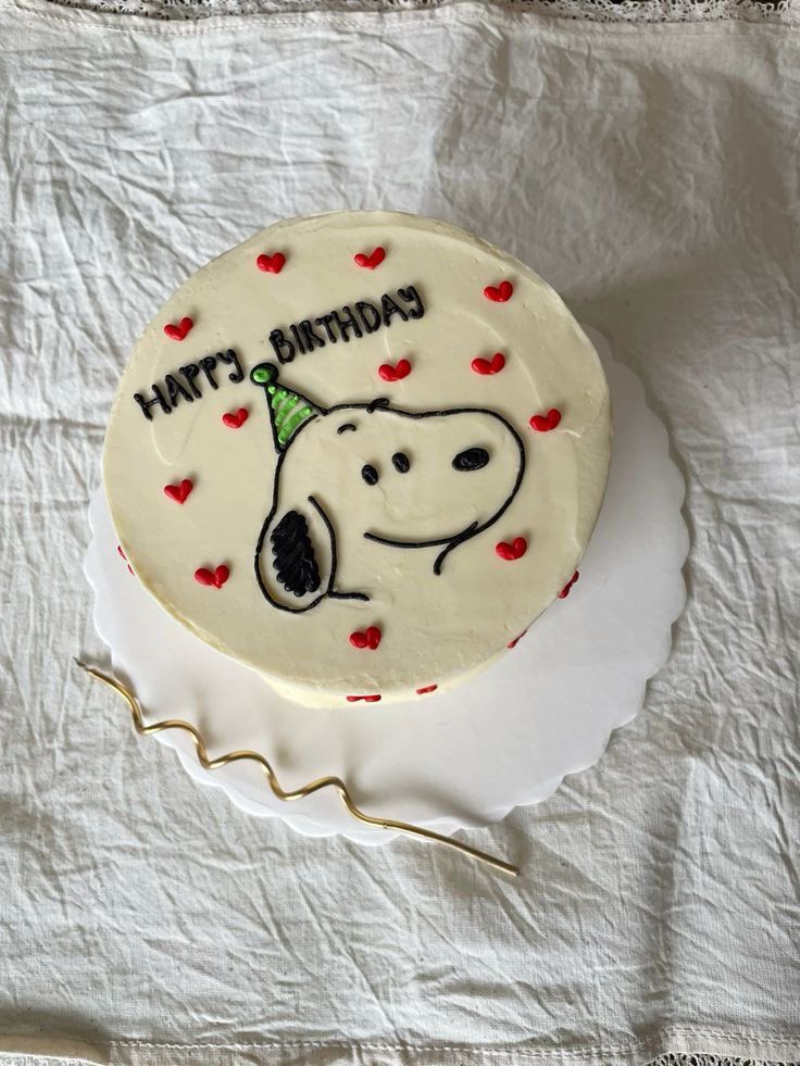 a birthday cake with the face of a dog on it