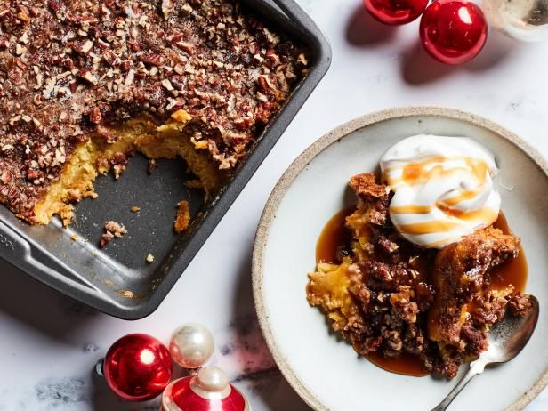 a plate with some food on it next to a pan filled with cake and ice cream