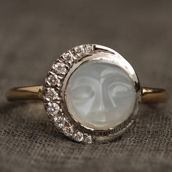 Man in the Moon Ring | Erica Weiner Vintage Oval Engagement Rings, Waning Crescent, Filigree Ring Gold, Man In The Moon, Moissanite Engagement Ring Halo, Twinkling Stars, In The Moon, Moonstone Engagement, Moonstone Engagement Ring