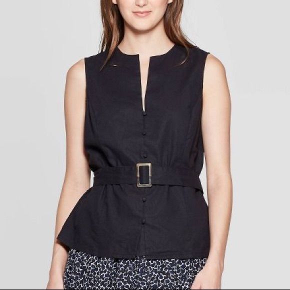 Make A Modern Power Move In The Sleeveless Belted Top From Who What Wear. Softly Structured From Breathable Cotton Linen, This Sleeveless, Collarless Shirt Balances Clean, Strong Lines With A Waist-Defining Built-In Belt To Enhance The Figure. Pair This Workwear Essential Back To A Well-Tailored Trouser, Or Wear It With A Flowing, Feminine Skirt For A Chic Study In Contrast. Brand New! Fast Shipping! Chic Cotton Tank Top With Buttons, Black Tank Top For Workwear In Spring, Spring Workwear Tank Top With Buttons, Cotton Tank Top With Button Closure For Work, Black Buttoned Summer Vest, Black Buttoned Vest For Summer, Sleeveless Tops With Button Closure For Work, Black Button Closure Tank Top For Summer, Sleeveless Buttoned Tank Top For Work