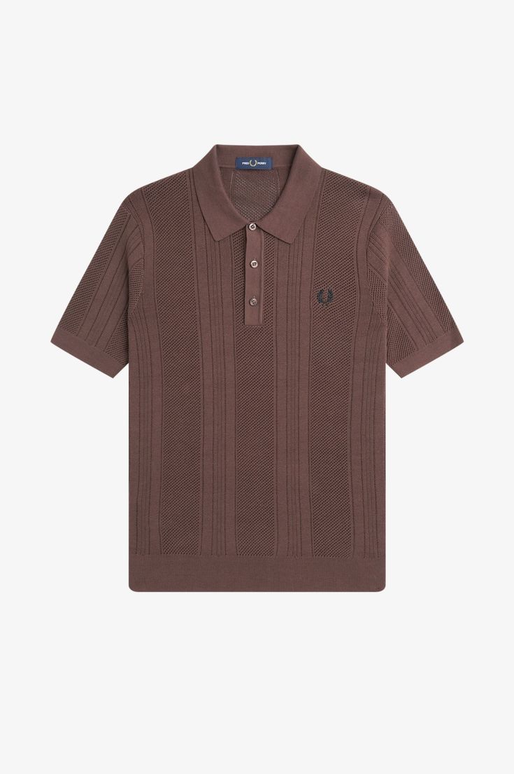 This regular fit polo shirt is crafted from cotton and draws inspiration from the traditional colors and cable knits of Fred's upbringing. Featuring an imitation crochet stitch, a three button placket, and the iconic Laurel Wreath logo embroidered on the left chest. Made for a timeless and classic look that is perfect for any occasion. Classic Cotton Knitted Tops, Classic Textured Knit Tops With Polo Collar, Classic Knit Tops With Button Closure, Classic Textured Knit Top With Polo Collar, Brown Knit Tops With Buttons, Classic Textured Knit Polo Collar Tops, Classic Knit Polo Collar Tops, Casual Collared Cable Knit Top, Classic Textured Knit Polo Shirt With Collar