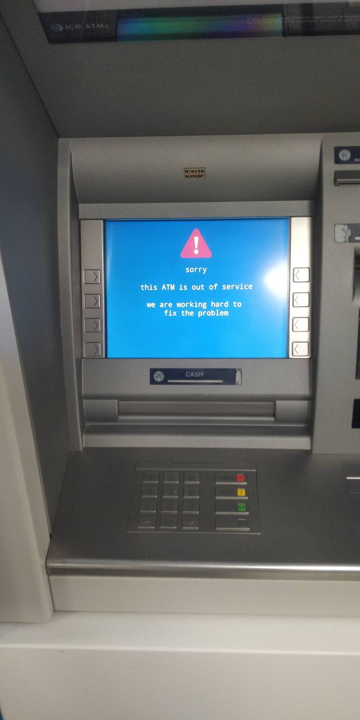 an atm machine with a blue screen on it