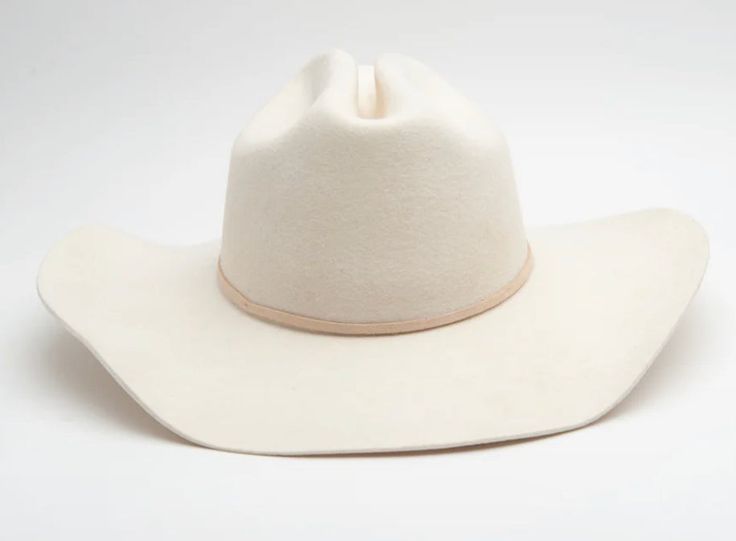 This hat is so beautiful and so elegant. The cream color is so pretty and would match with basically anything! This is more of a cowboy hat shaped hat.. rather than the flat/sun hats we have. Come with leather band (we can customize). One size fits all, adjustable band, 100% Wool. White Adjustable Curved Brim Felt Hat, White Adjustable Felt Hat With Curved Brim, White Adjustable Hat With Flat Crown, White Adjustable Flat Crown Hat, White Western Felt Hat For Kentucky Derby, White Flat Brim Hat For Ranch, White Rigid Hat For Ranch, White Western Felt Hat With Curved Brim, Western White Felt Hat With Curved Brim