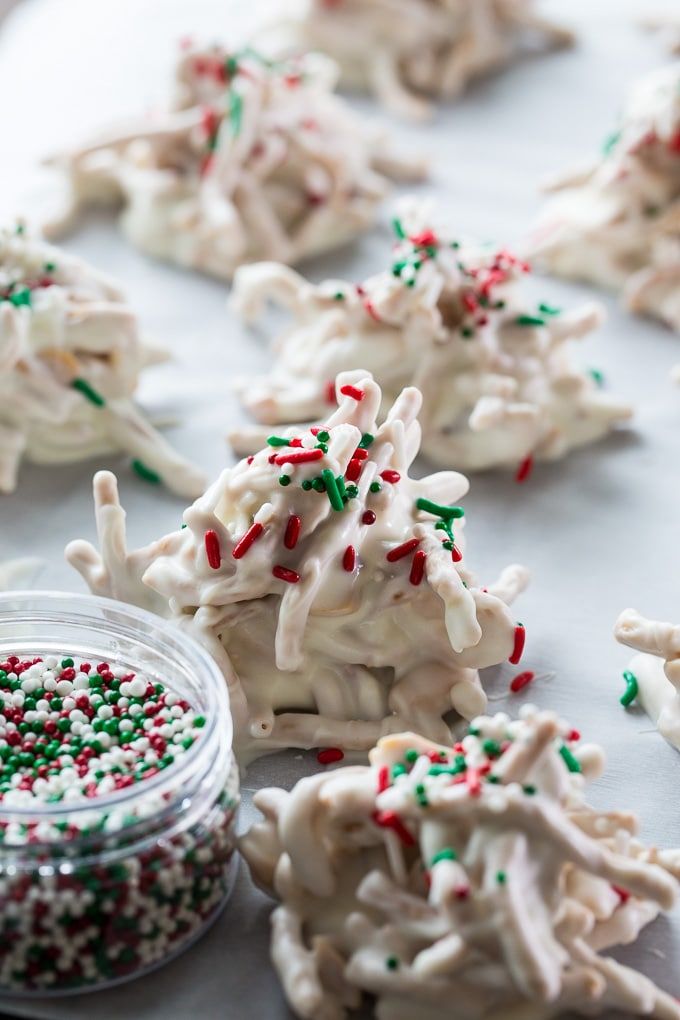 some white and green sprinkles are on the table