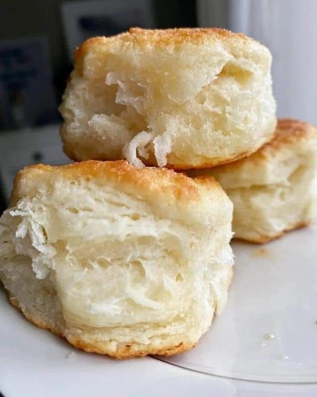 two pieces of bread sitting on top of a white plate