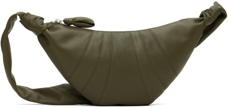 Paneled grained leather messenger bag in khaki. Topstitching throughout. · Knotted detailing at fixed shoulder strap · Padded pull-tab at zip closure · Patch pocket at interior · Cotton canvas lining · H7 x W14 x D2 in Supplier color: Dark moss Croissant Bag, Leather Messenger Bag, Leather Messenger, Womens Crossbody Bag, Medium Bags, Online Bags, Pull Tab, Green Bag, Wide Straps