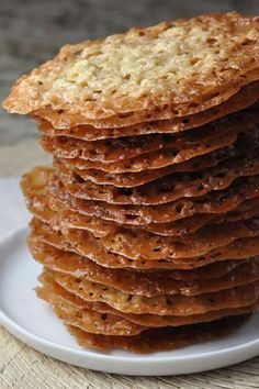 a stack of crackers sitting on top of a white plate