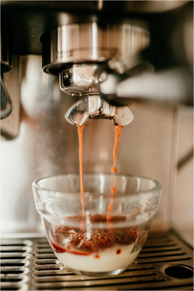 coffee being poured into a glass bowl