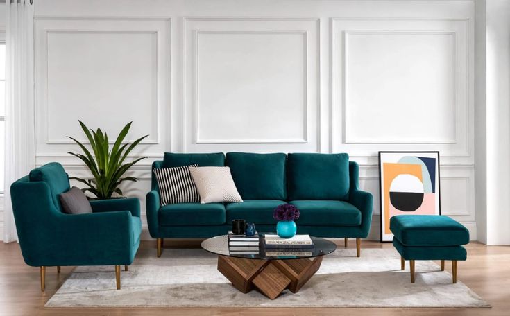 a living room with white walls and blue furniture