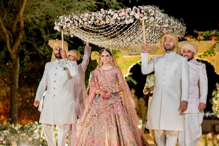 Bride Entry Chadar, Flower Chadar, Bride Aisle, Jaisalmer Wedding, Bride Entry, Bride And Groom Outfits, Flower Garland Wedding, Desi Wedding Decor, Wedding Planning Decor