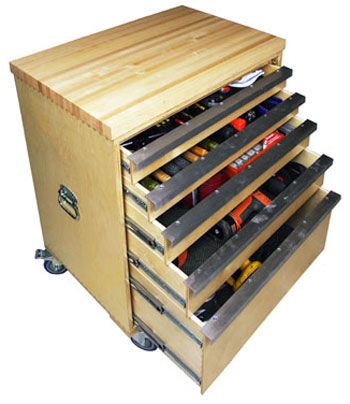 a wooden tool cabinet with drawers and tools in it's drawer compartments on wheels