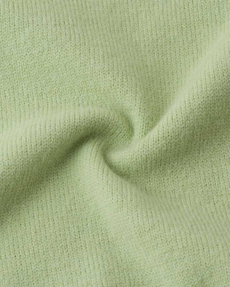 a close up view of a green fabric