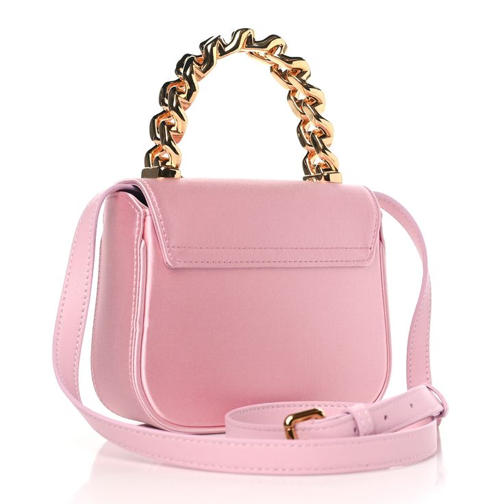 This is an authentic VERSACE Satin Crystal Studded Mini La Medusa Bag in English Rose. This bag is crafted of pink satin with multicolor crystal embellishments. It features a removable strap and gold hardware, including a top handle and a Medusa emblem. The front flap opens to a purple leather interior with card slots. English Rose, English Roses, Purple Leather, Crystal Embellishment, Pink Satin, Leather Interior, Gold Hardware, Top Handle, Card Slots