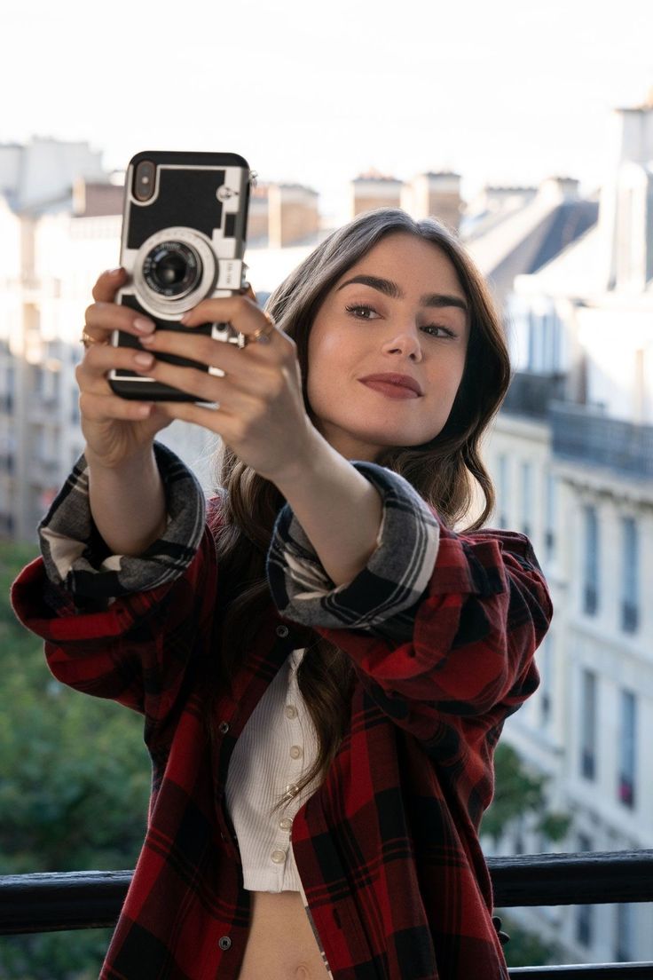 a woman taking a selfie with her camera