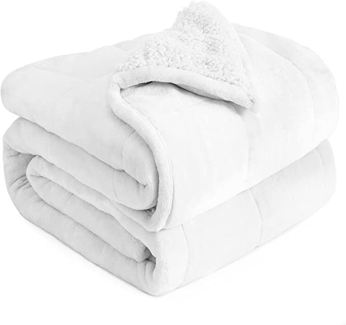 a white blanket folded on top of each other