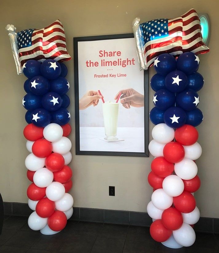 some balloons are in the shape of american flags