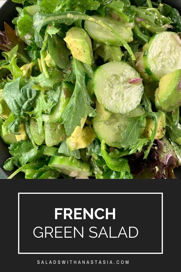 french green salad with cucumbers and lettuce in a black bowl