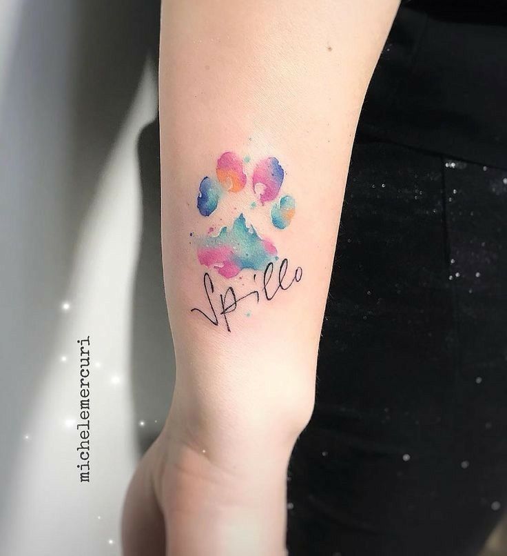 a person with a tattoo on their arm that has the word sparkle painted on it