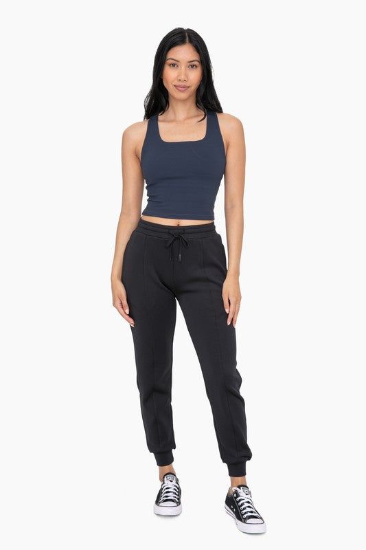 Unleash your inner athlete with our Everyday Comfort Jogger. Made from a soft and stretchy blend, these joggers feature an elastic waistband with a drawstring and convenient zippered pockets. Perfect for lounging or on-the-go, these cuffed joggers offer both comfort and style in one. Model is 5'8" Size 2 and wearing a Size Small. AP7013 Trendy Sports Sweatpants With Elastic Waistband, Athleisure Activewear With Drawstring For Loungewear, Stretch Sweatpants With Drawstring For Workout, Stretch Sweatpants With Drawstring In Sportswear Style, Stretch Sweatpants With Drawstring For Sportswear, Sports Activewear With Drawstring Long Pants, Stretch Sweatpants With Drawstring, Drawstring Long Pants Activewear For Sports, Trendy Drawstring Sweatpants For Jogging