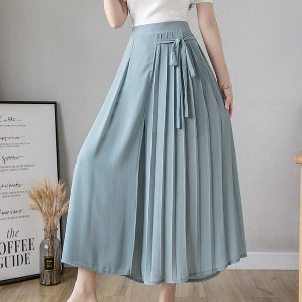 Get the best of both worlds when wearing our Venise Skirt Pants. The comfort of pants comes with the beauty of a skirt for a two-in-one stunning piece. The chiffon fabric adds to its comfortable feel allowing it to stay breathable and wearable in cold or warm climates. Wear these pants for a fashionable day out with friends when you want to dress to impress. Trouser Skirt, Overalls Plus Size, Pleated Chiffon Skirt, Pleated Chiffon, Hippie Dresses, Tank Top Camisole, Chiffon Skirt, Pant Length, Overall Dress