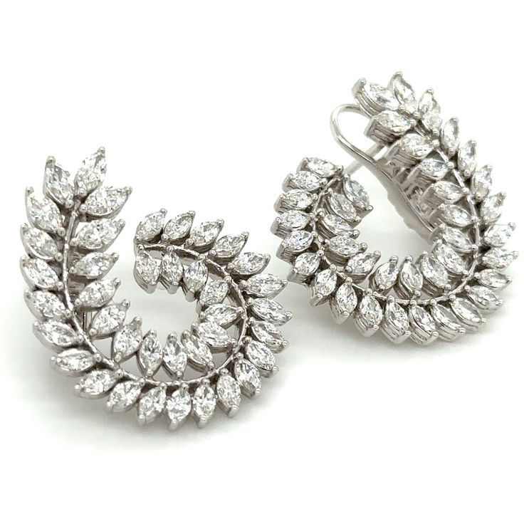 Adorn yourself lavishly with these exquisite statement earrings, crafted with 3.66carat total weight of striking marquise cut diamonds. Indulge in their magnetic shimmer and regal design to elevate any look and occasion into a truly luxurious experience. Each earring is 27mm in length 29mm width and the design is definitely statement making. Metal: 18K White GoldDiamond Weight: 78 Marquise Cut diamonds 3.66ct twBacking: Clasp Back Dimensions: 24mm x 24mm Regal Design, Marquise Cut Diamond, Marquise Cut, White Gold Diamonds, Statement Earrings, Gold Diamond, Diamond Cuts, Fine Jewelry, White Gold