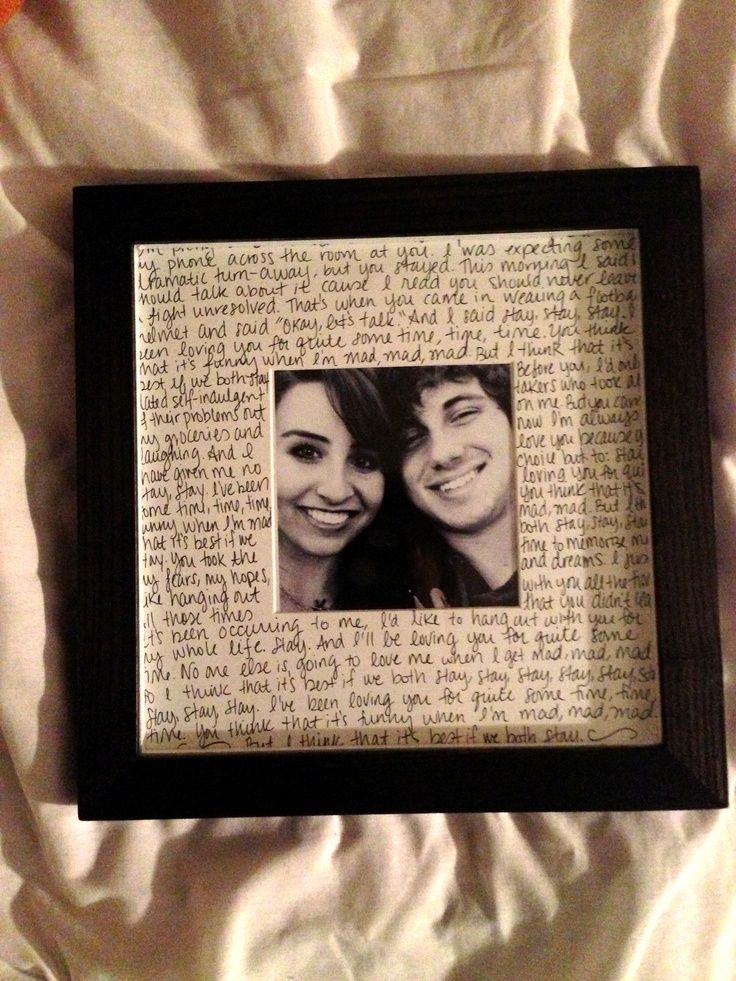 an old photo frame with two people on it