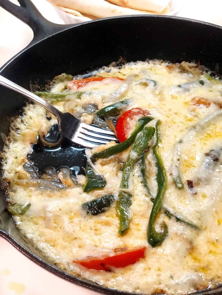 a skillet with some food inside of it