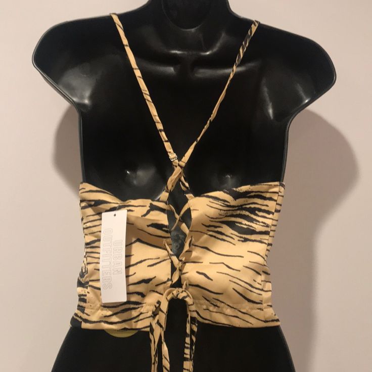 Printed Cropped Top From Urban Outfitters Cut In A Slim Fit With A Tie Closure At The Strappy Back. 97% Polyester, 3% Spandex; Machine Wash; Imported. Bin7-#3 Casual Party Crop Top From Urban Outfitters, Casual Party Crop Top By Urban Outfitters, Trendy Strappy Tops For Day Out, Chic Tiger Print Tops For Spring, Casual Strappy Tops With Tie Back, Chic Strappy Tops For Vacation, Chic Strappy Vacation Tops, Chic Strappy Tie Back Tops, Casual Strappy Crop Top For Party